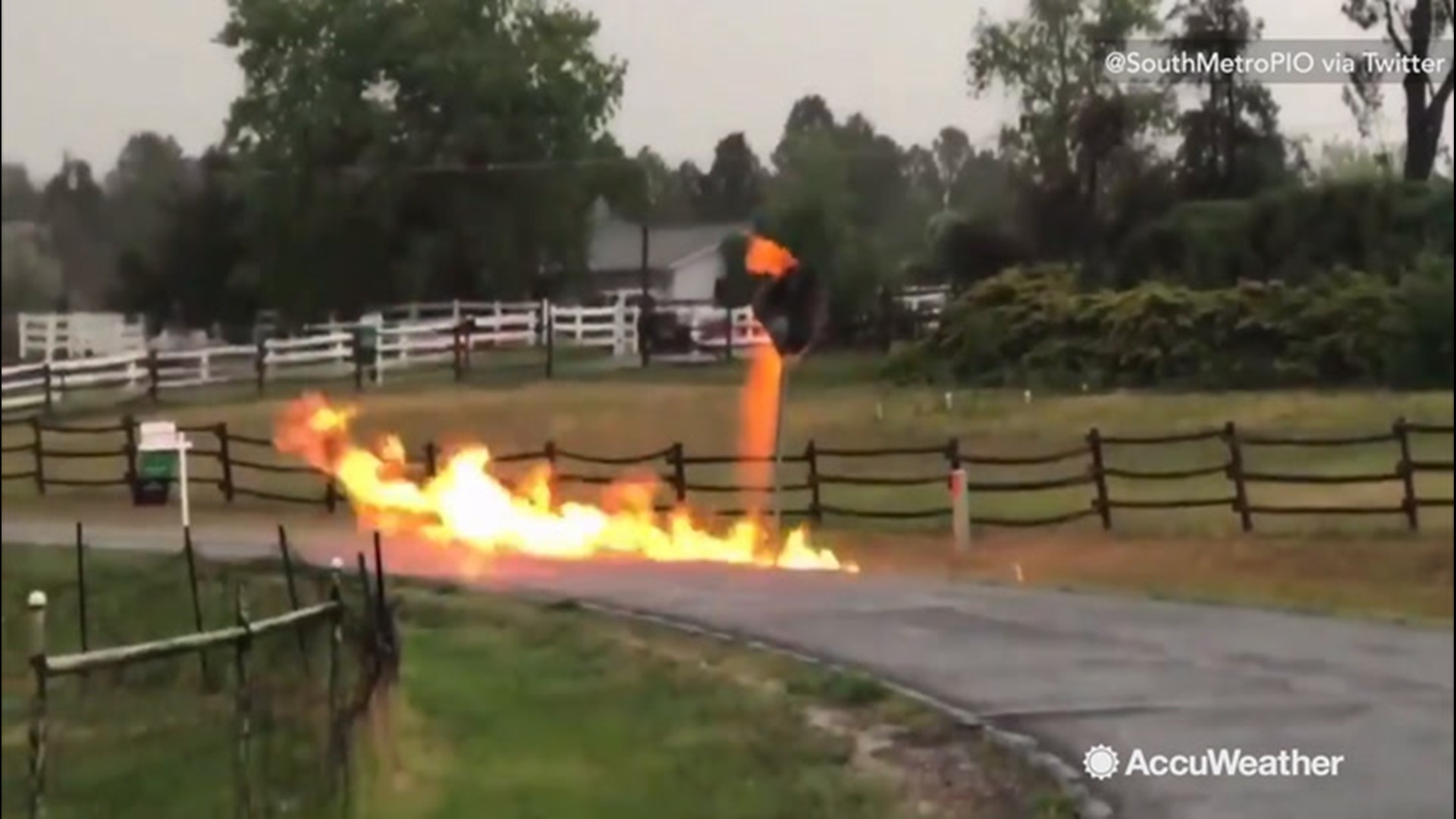 A street sign in Foxfield, Colorado, ignited into a raging fire on June 17, after lightning struck a nearby gas line. Firefighters were not able to put the fire out using water, as the gas line needed to be shutoff.