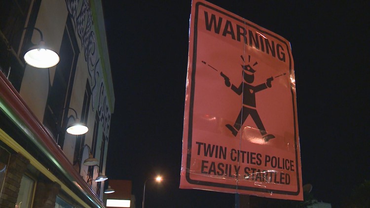 Mystery signs mock Mpls. Police
