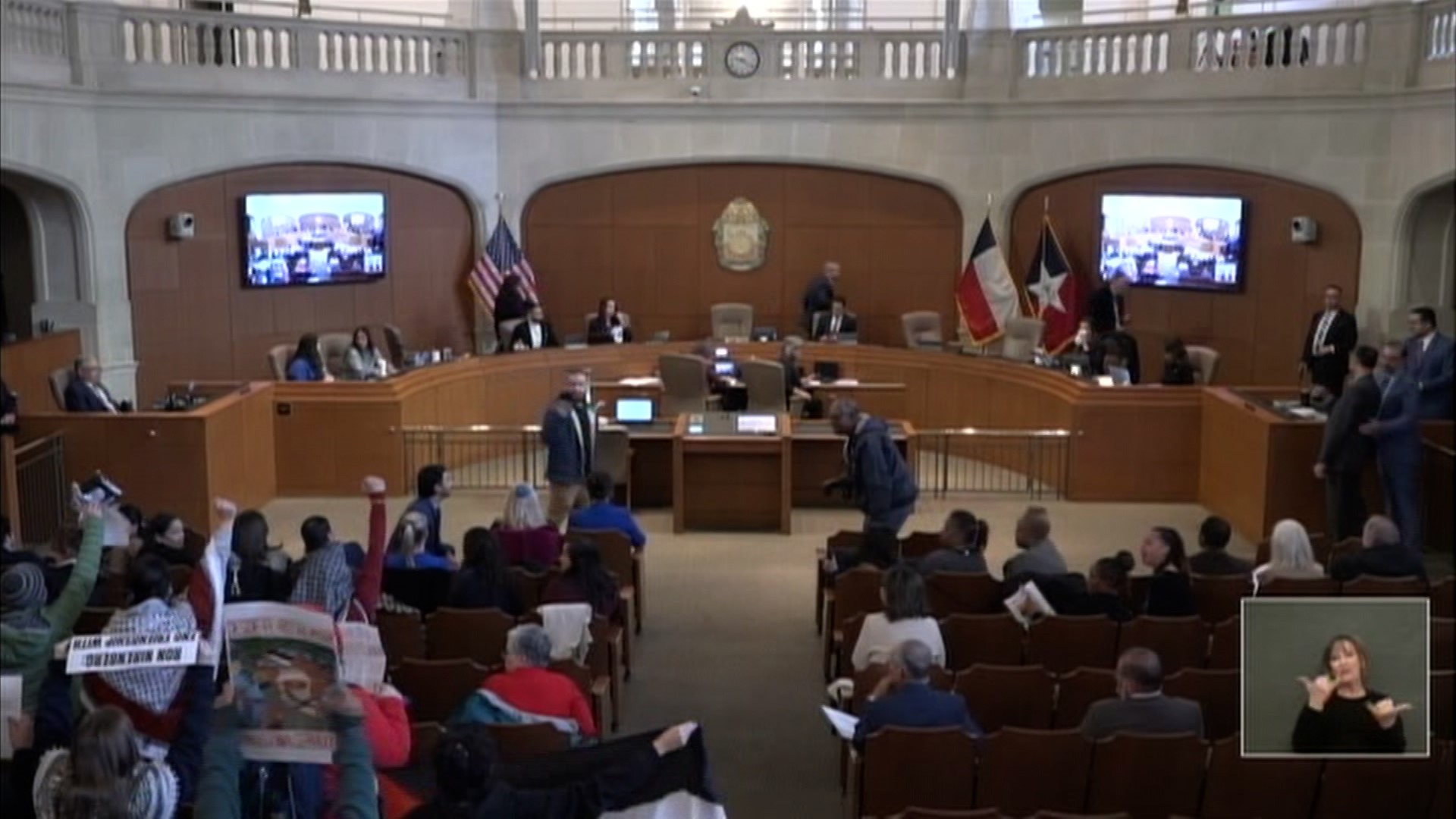 Mayor Ron Nirenberg motioned the meeting into recess shortly after it began after being drowned out by the chants of protesters.