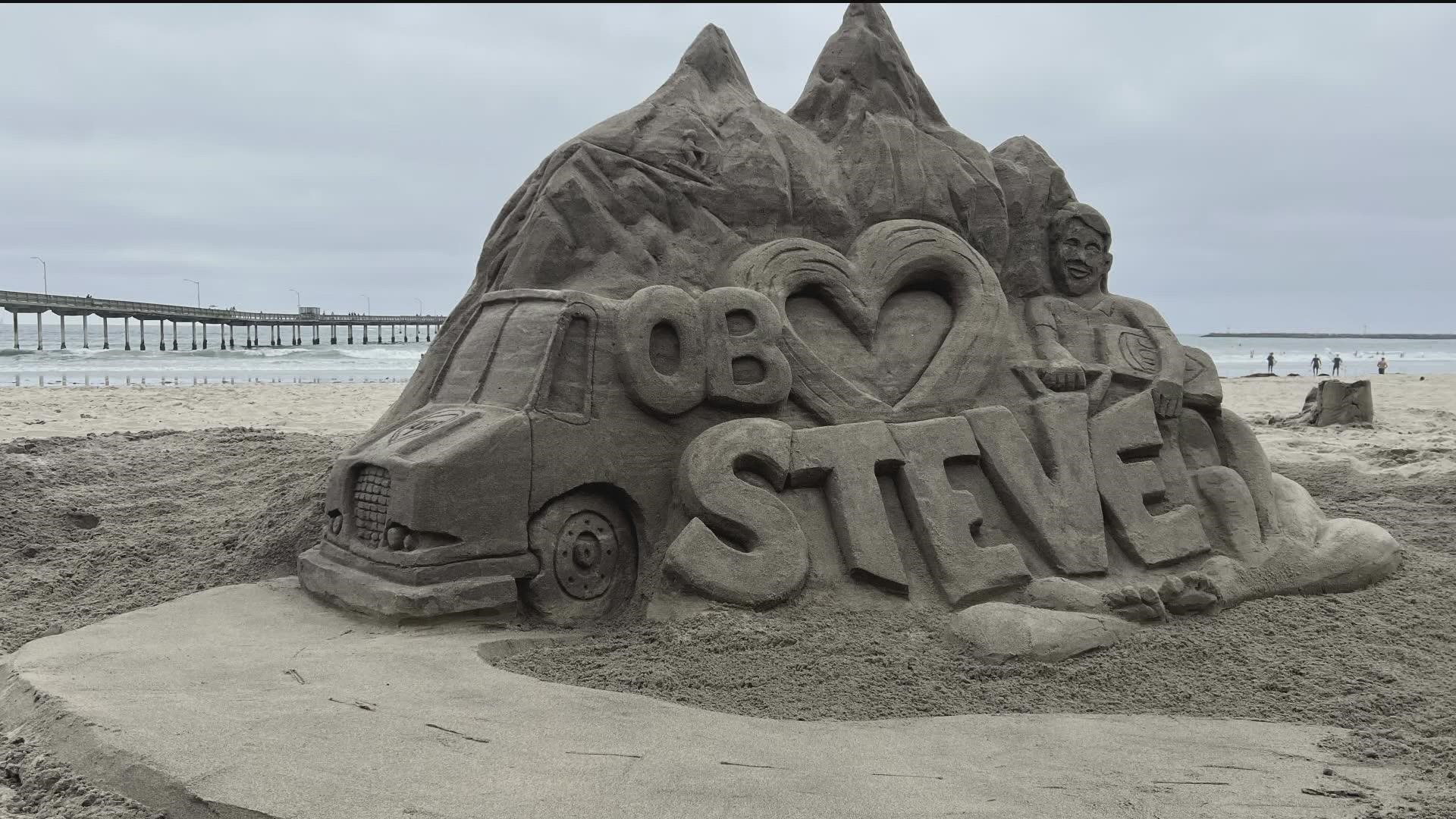 Steve Krueger, a beloved UPS driver killed on the job when a plane crashed into his truck in Santee, is being honored with a unique sand sculpture in Ocean Beach.