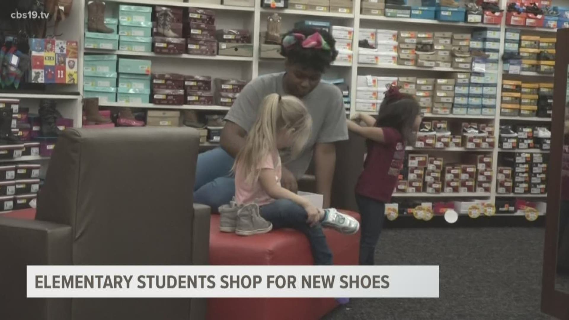 Elementary students shop for new shoes