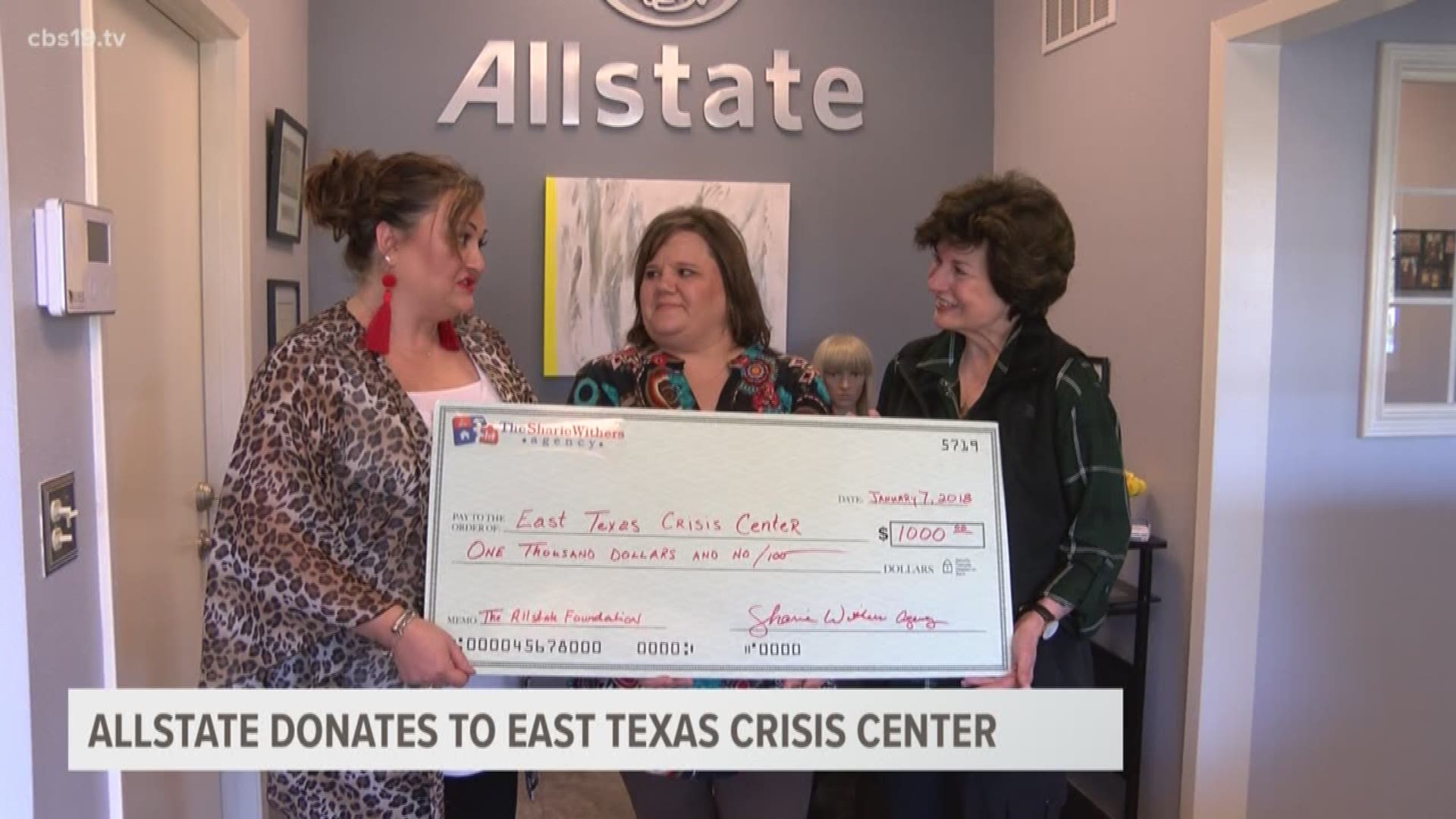 Allstate Agent Sharie Withers Presents one of nine $1.000 checks to Lana Peacock from the East Texas Crisis Center.  The Total $9,000 donation was made on behalf of local Allstate agencies who also held drives to collect Toiletry items for clients of the