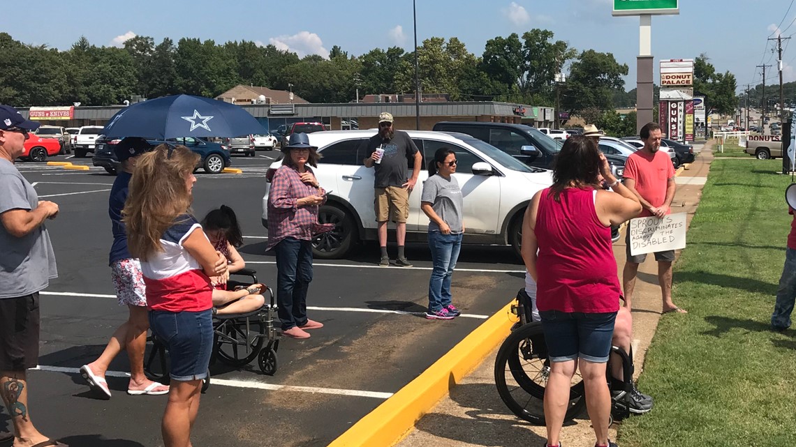 Demonstrators gather outside Sprouts in Tyler protesting mask policy