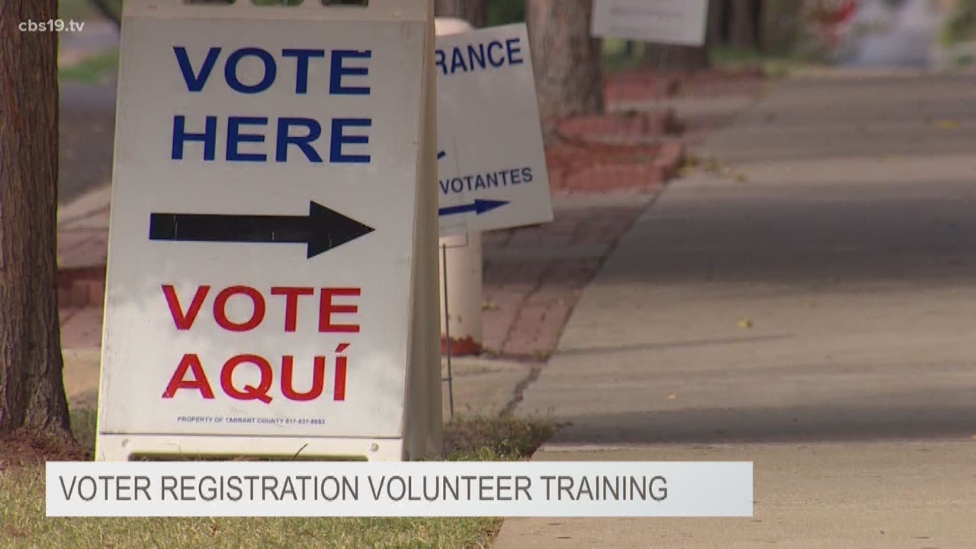 Taeler DeHaes talks to volunteers helping others register to vote