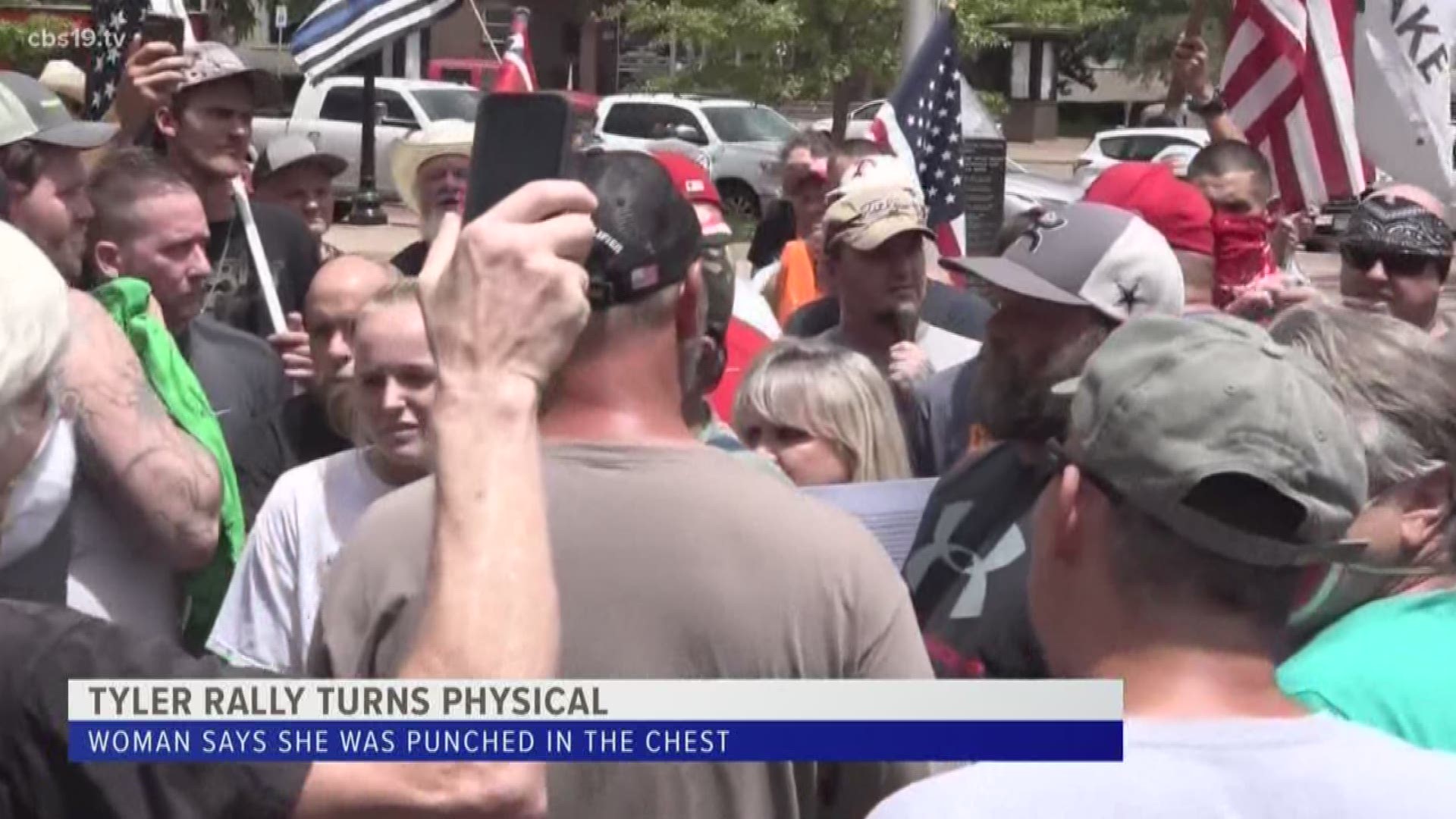 A woman says she was punched in the chest during a rally that took place Sunday in downtown Tyler.