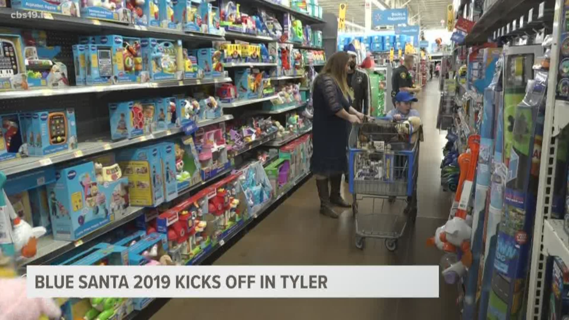 Children go on a shopping spree with law enforcement for Annual Blue Santa event