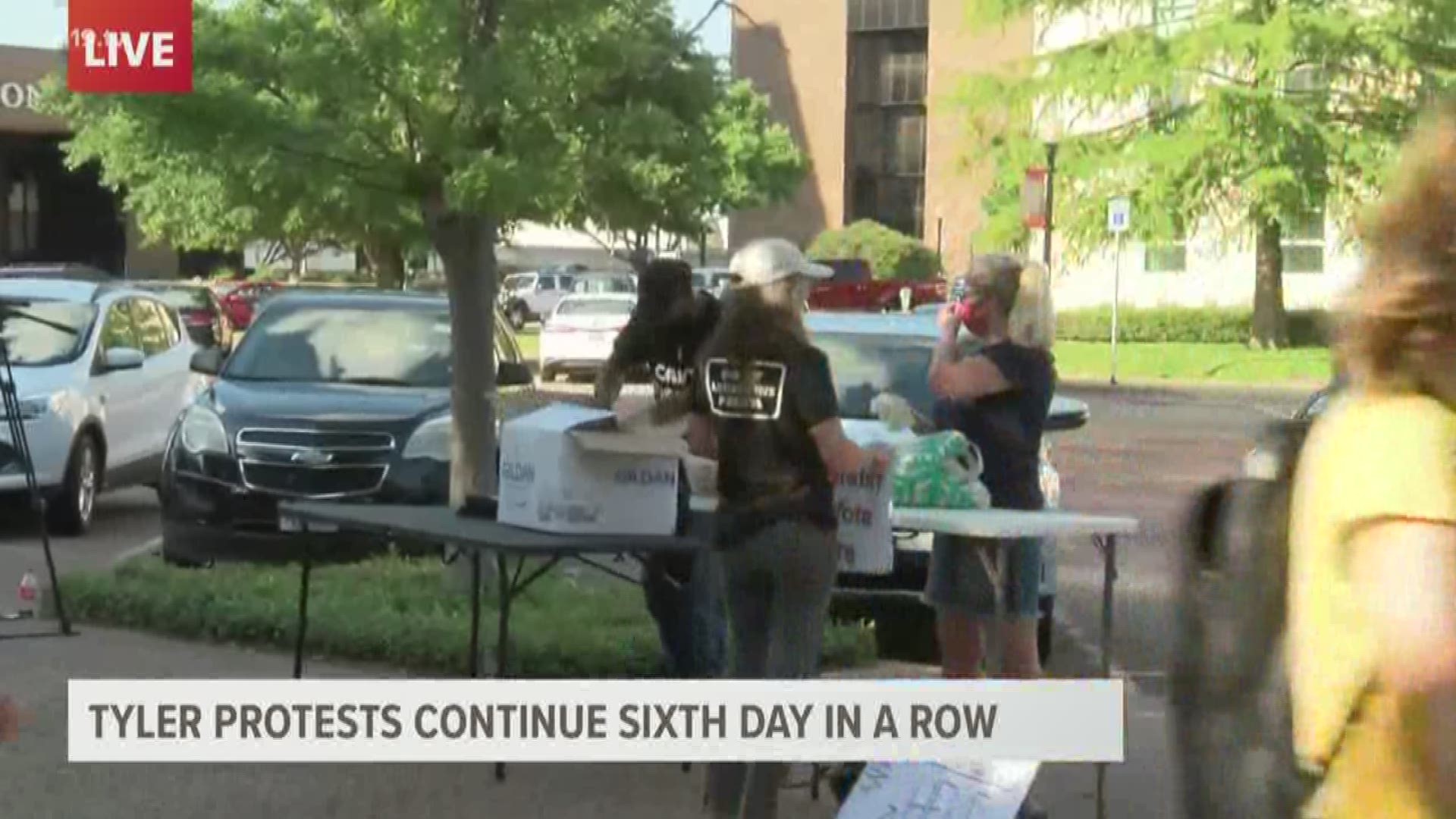 Demonstrators moved back downtown after protesting at Broadway Square Mall.