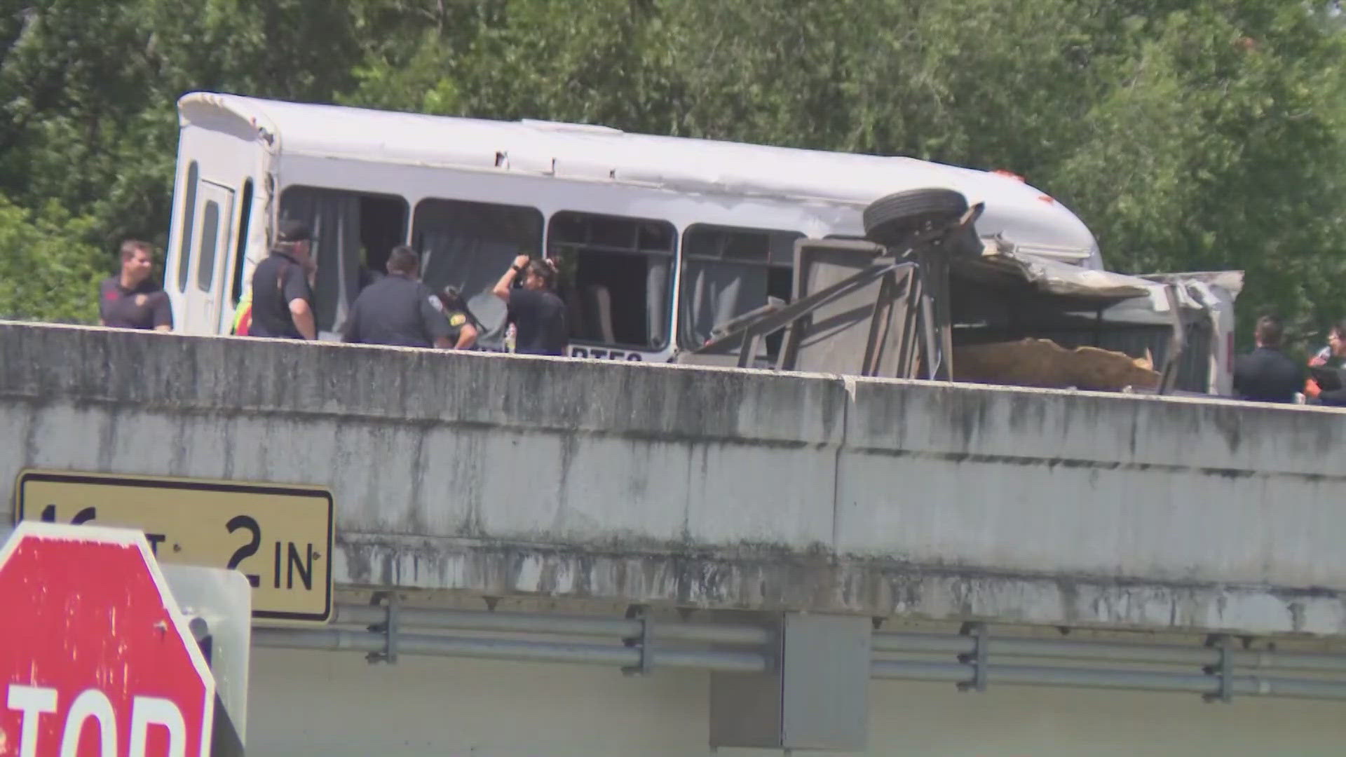 More than a dozen people were hospitalized, and authorities are looking for four suspects who fled the stolen vehicle after the wreck.
